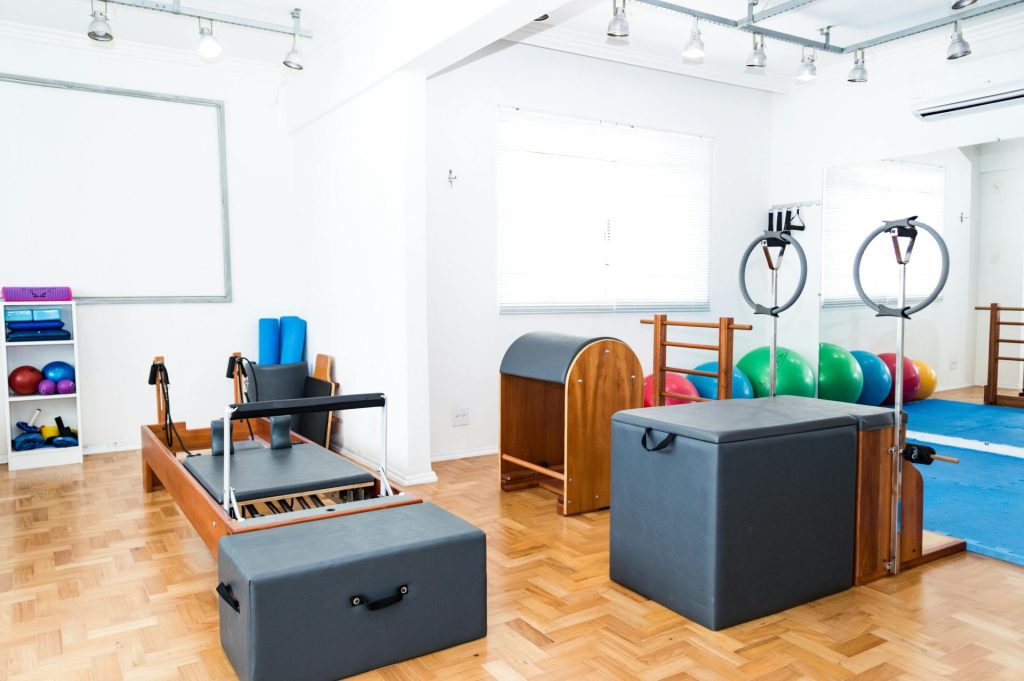 Spacious Pilates studio with modern equipment and vibrant exercise balls.
